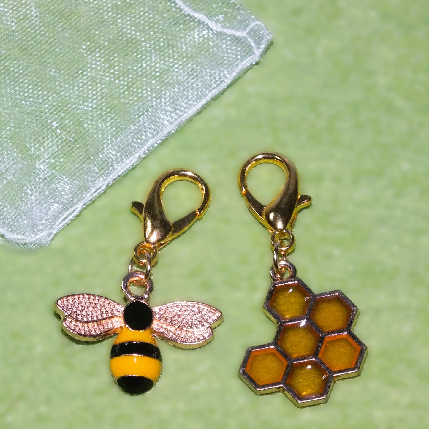 2pcs bee & honeycomb enamel, metal & resin dangle charms. A pretty pair!