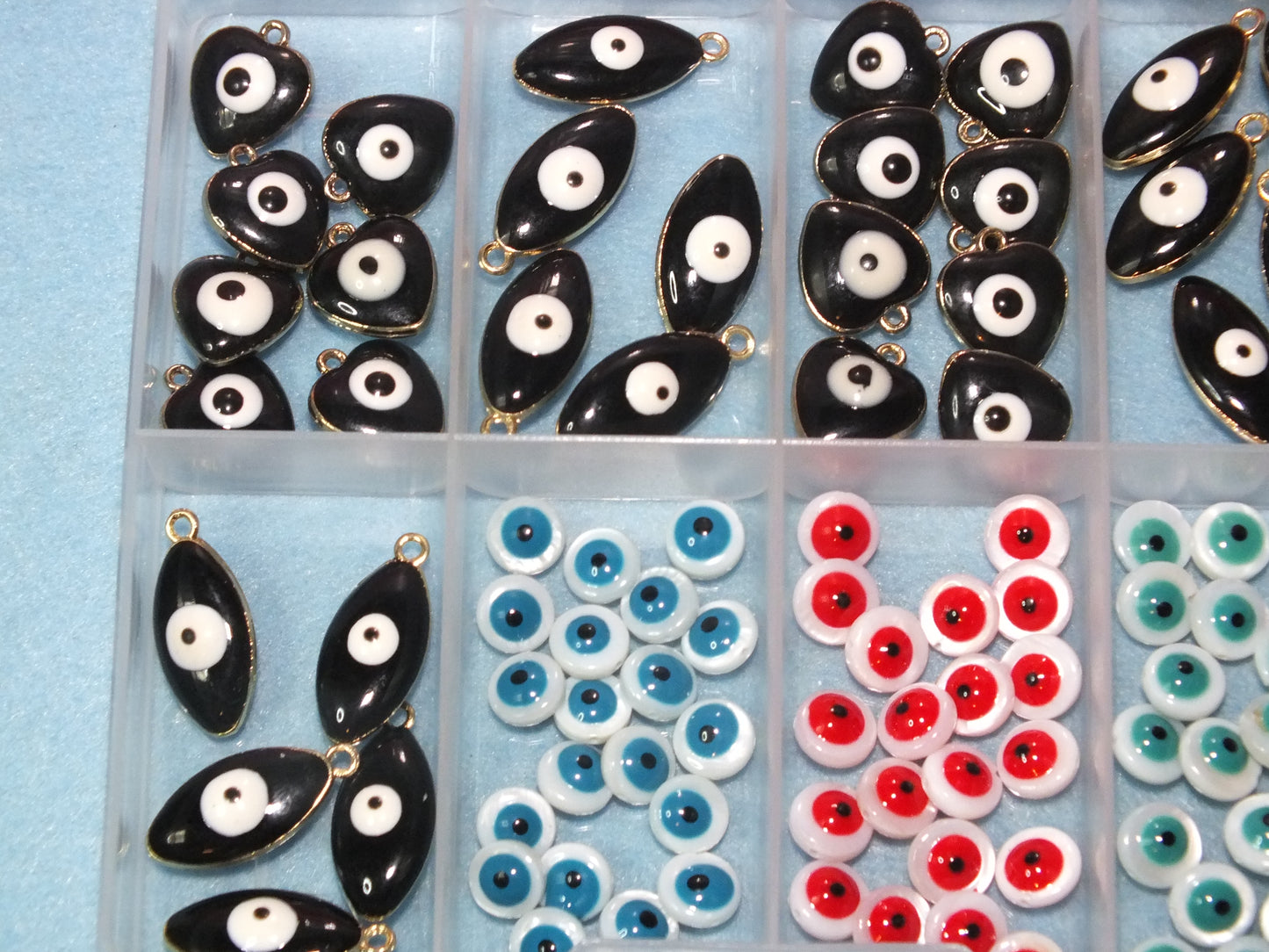 90pcs Evil Eye beads & charms in a storage box, including freshwater shell beads