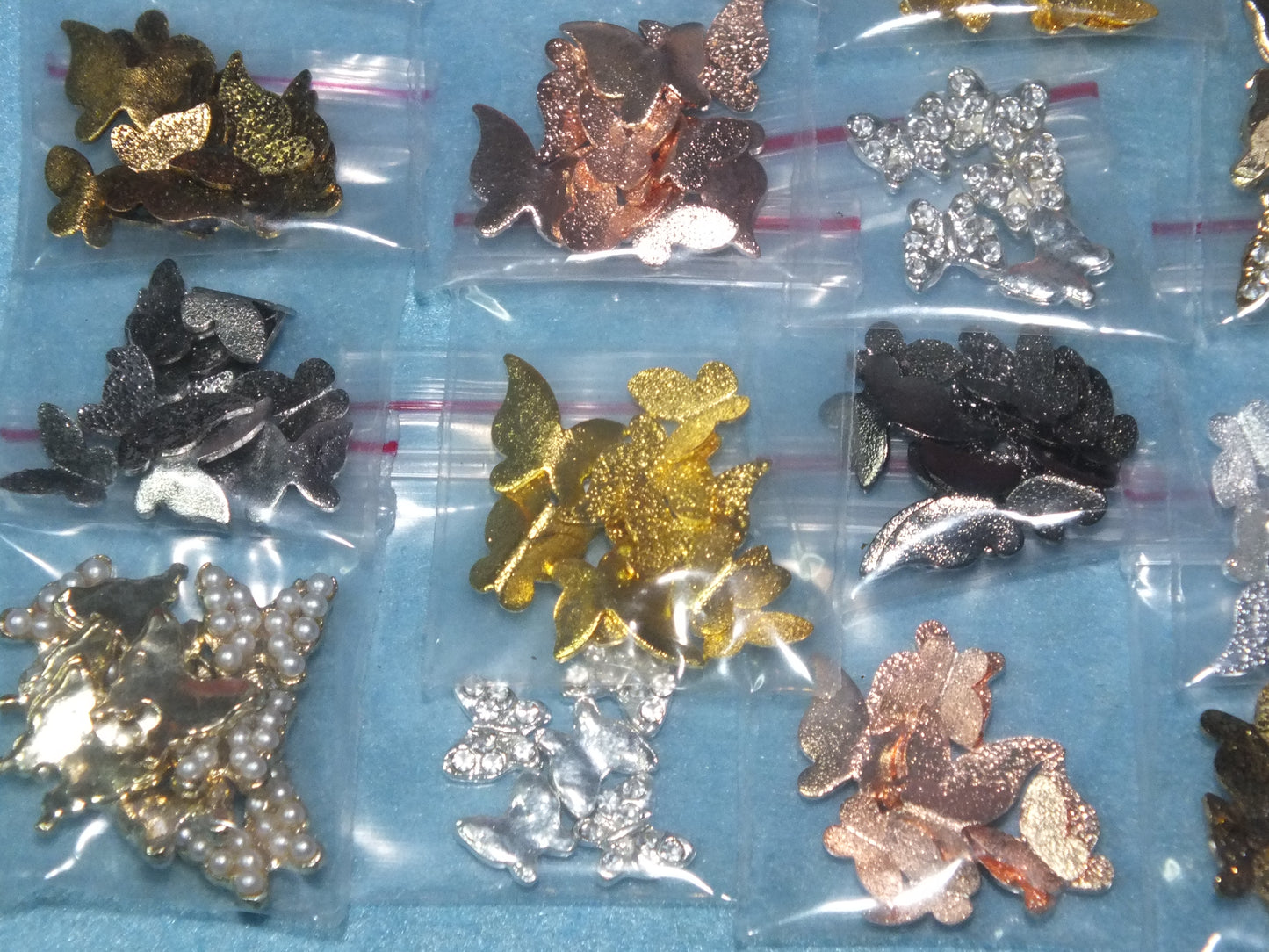 16 packs (150pcs) 3D metal butterfly cabochon charms, different styles & colours