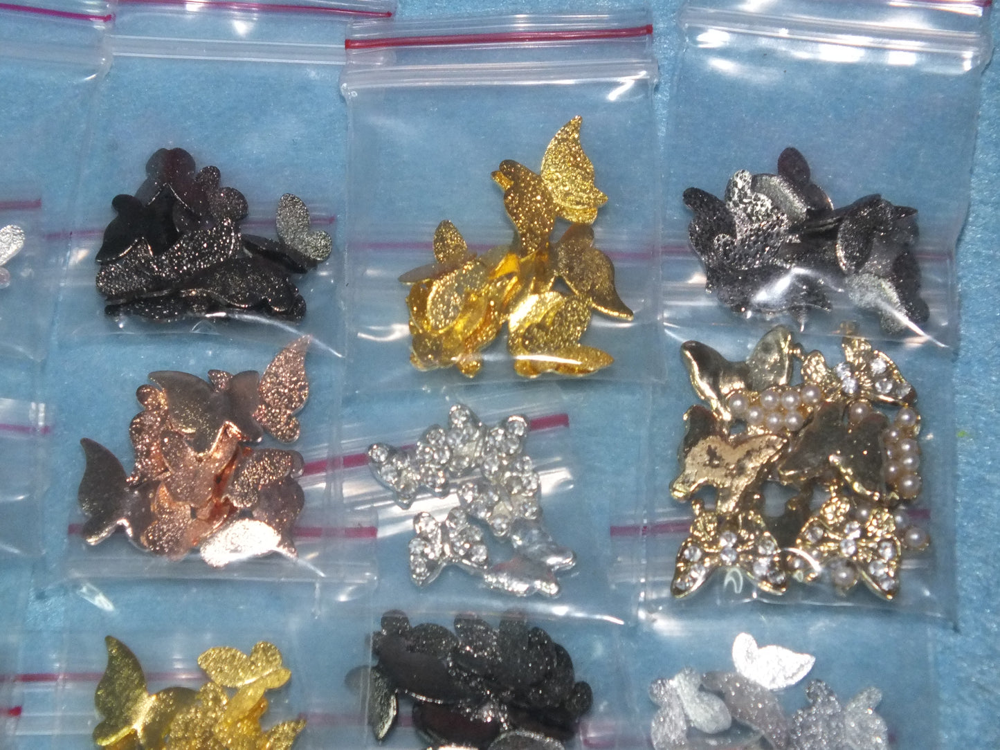 16 packs (150pcs) 3D metal butterfly cabochon charms, different styles & colours
