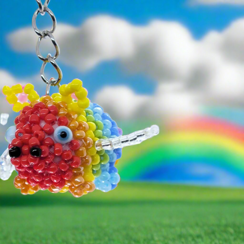 Flying Pride piggies - handmade rainbow beaded pigs (squishy!) on a keyring!
