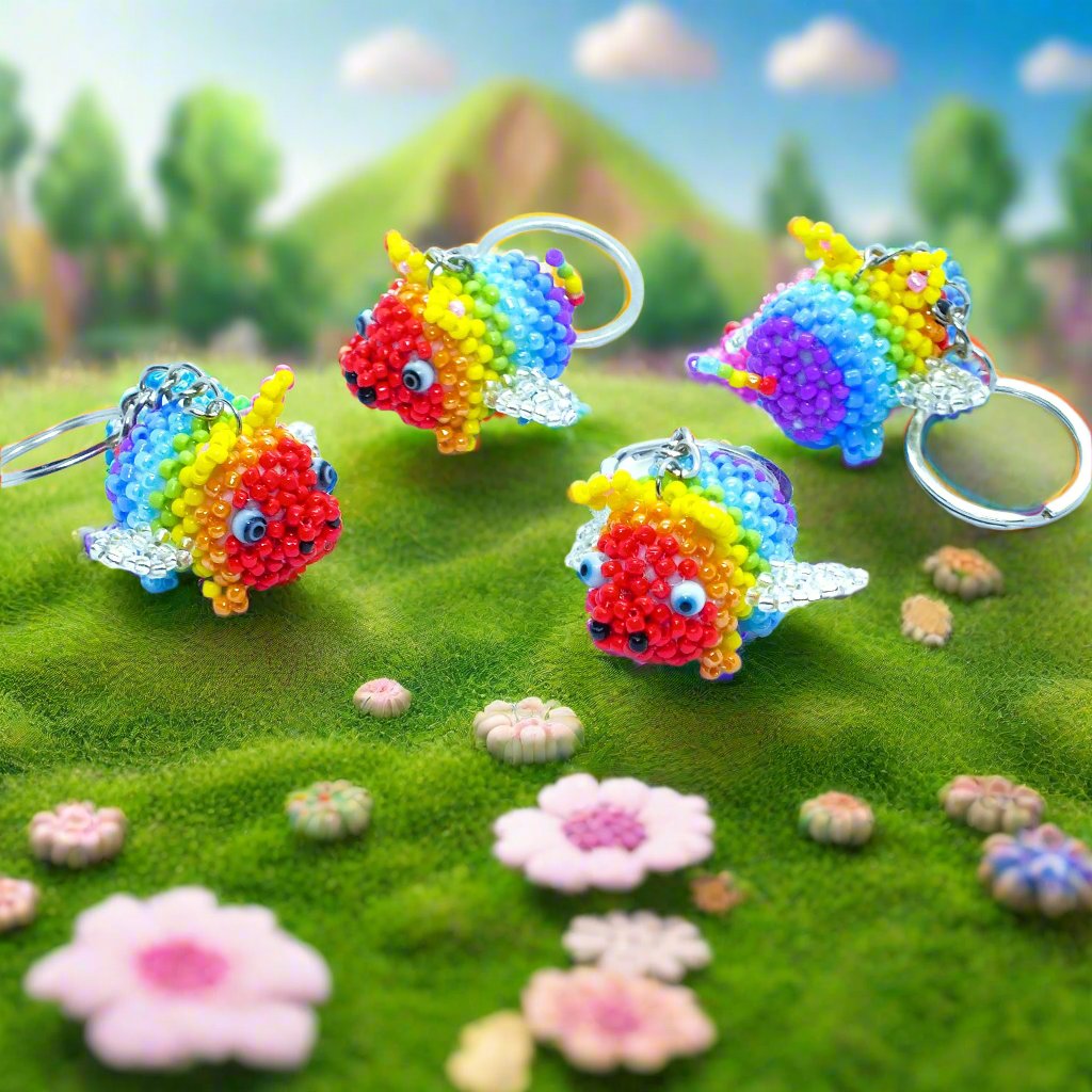 Flying Pride piggies - handmade rainbow beaded pigs (squishy!) on a keyring!