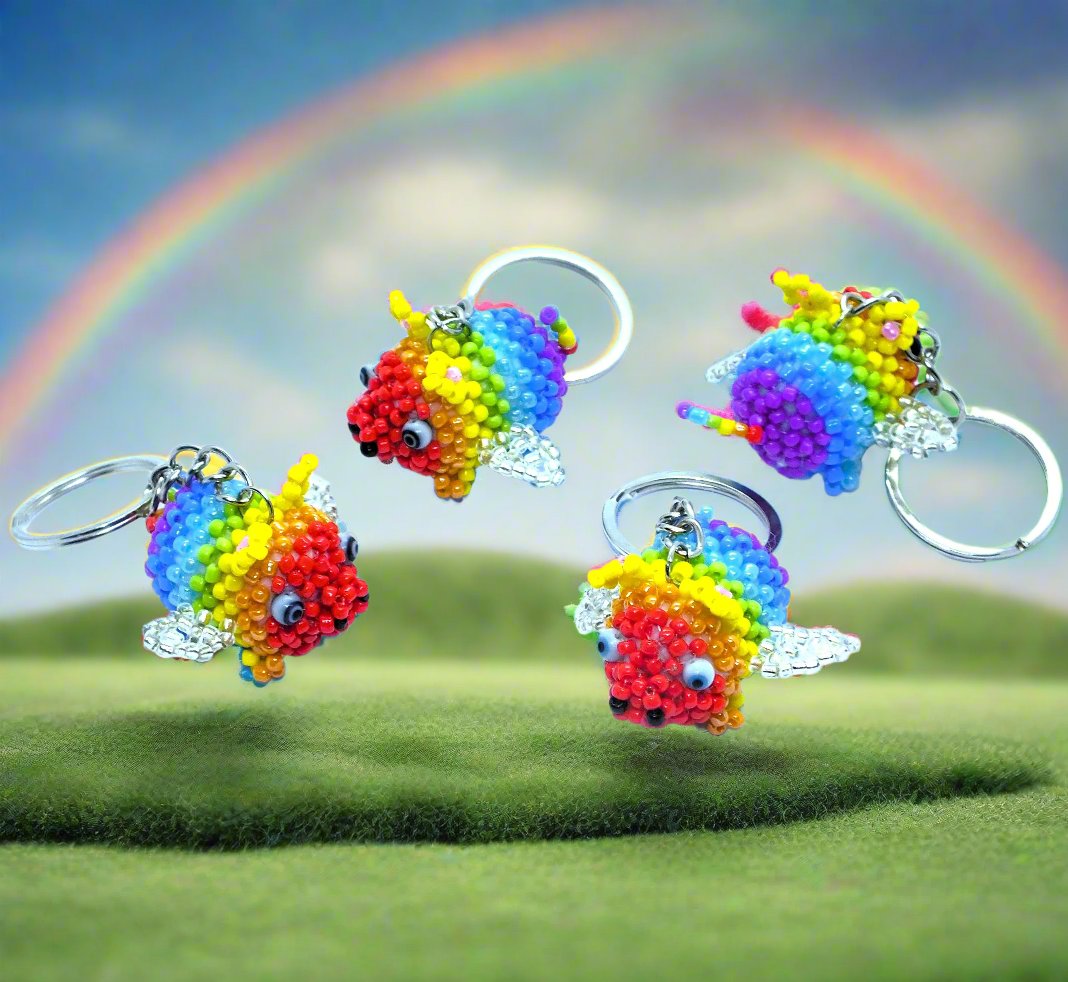 Flying Pride piggies - handmade rainbow beaded pigs (squishy!) on a keyring!