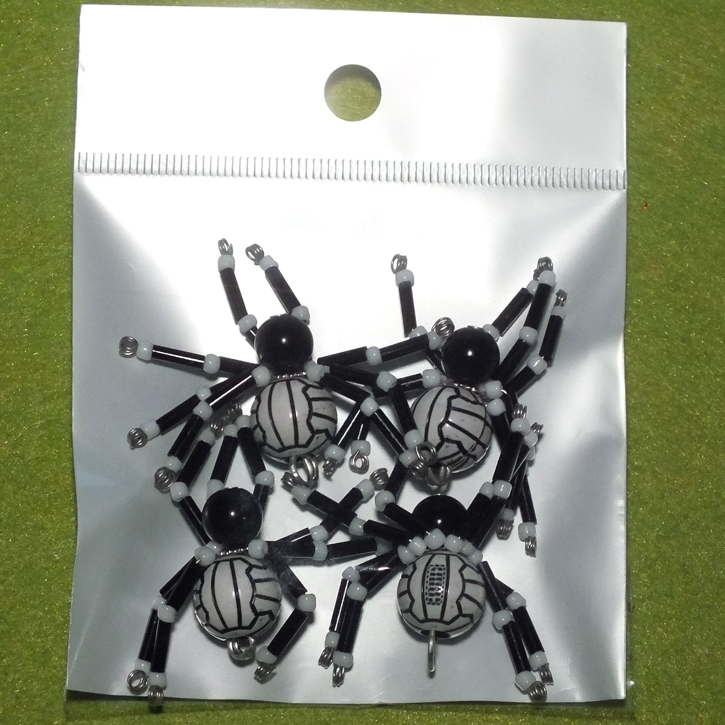 4-pack beaded spider charms - "Crunching Tackler", handmade - plain or on lanyards