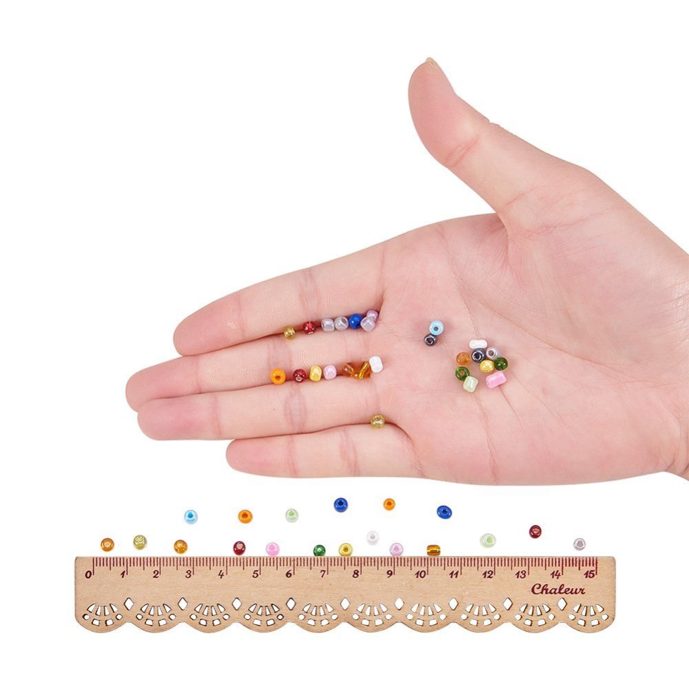 5850pcs box 15 colours of 4mm mixed seed beads. 390pcs per colour - pearlised, translucent, opaque, silver lined, rainbow finish.