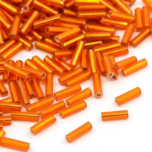 Orange silver lined 6-8mm glass bugle beads, 50g