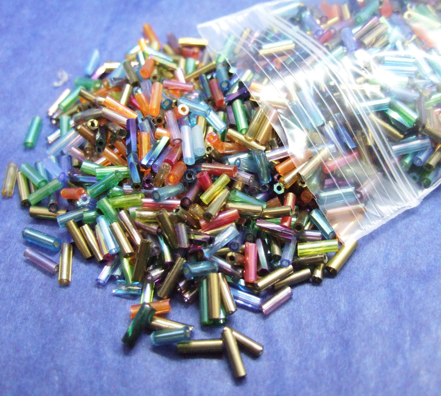 Iridescent mix 6-8mm glass bugle beads, 50g