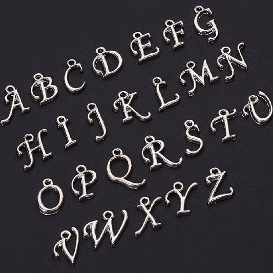 A-Z set of silver tone rack plated alphabet letter charms, 12mm - 17mm