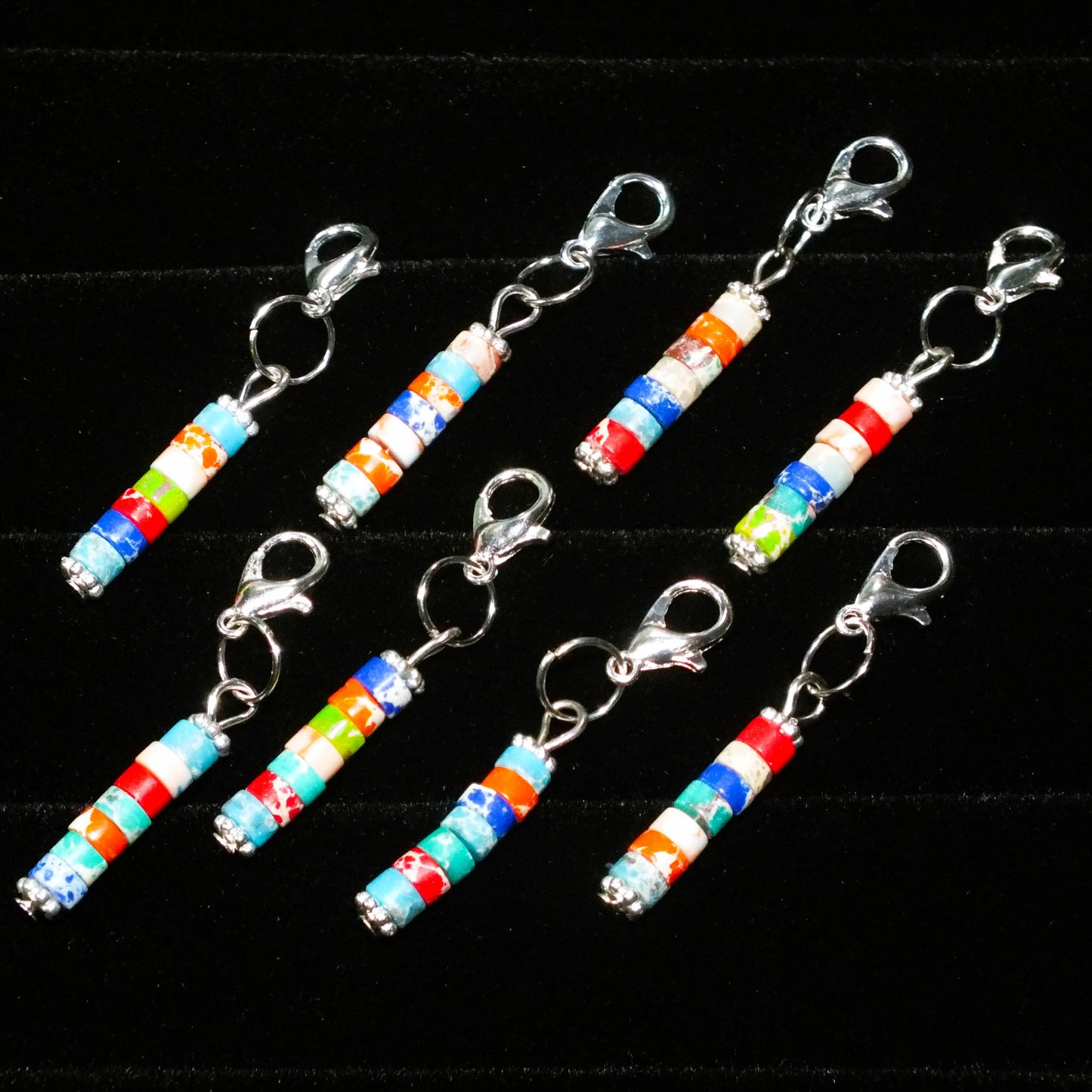 8 multicoloured stone column dangle charms on clasps