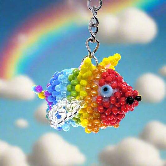 Flying Pride piggies - handmade rainbow beaded pigs (squishy!) on a keyring!