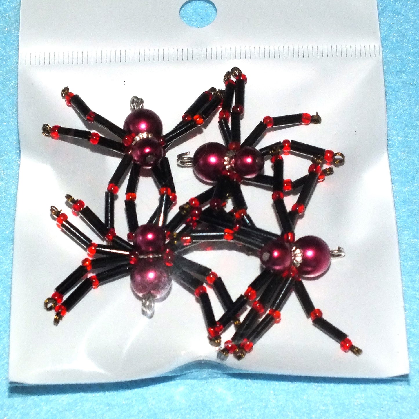 4-pack beaded spider charms - "Red-kneed Wine Slurper", handmade - plain or on lanyards