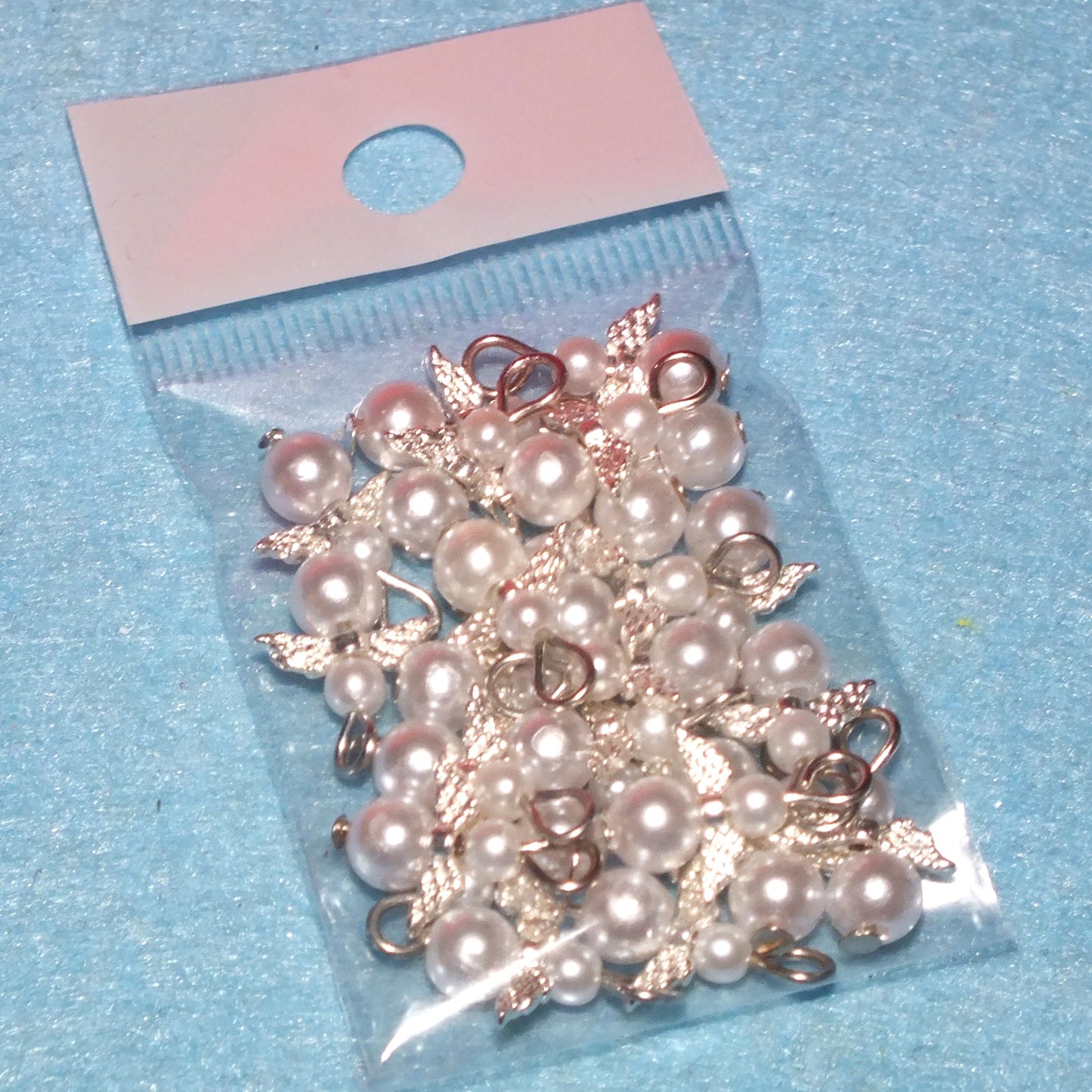 White pearl angel charms (24-250pcs, plain, on clasps or lanyards)