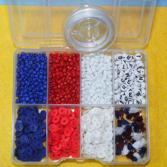 1,150pcs red, white & blue bead craft box + elastic - letters, beads, tassels.