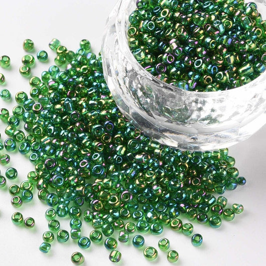 2mm translucent rainbow finish green glass seed beads, 50g
