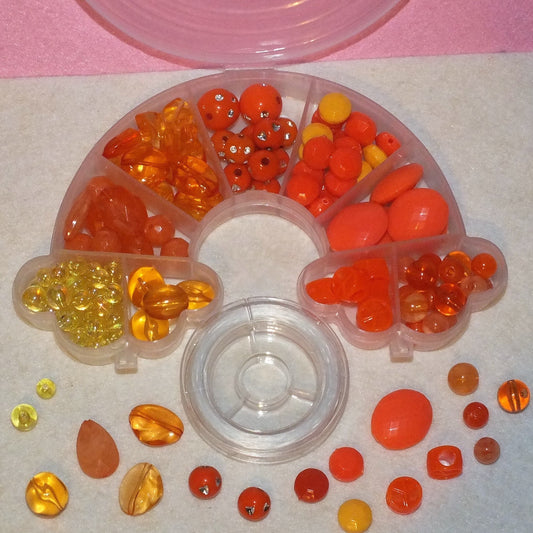 Orange mix crafting kit, with a reel of elastic